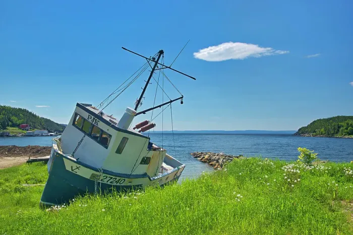 Framed Print : Fishing boat along the shoreline of White Bay. Baie Verte Peninsula. Newfoundland & Labrador, Canada