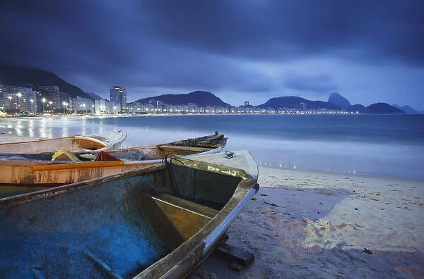 Fishing boats on Copacabana beach at dusk, Rio de Janeiro, Brazil