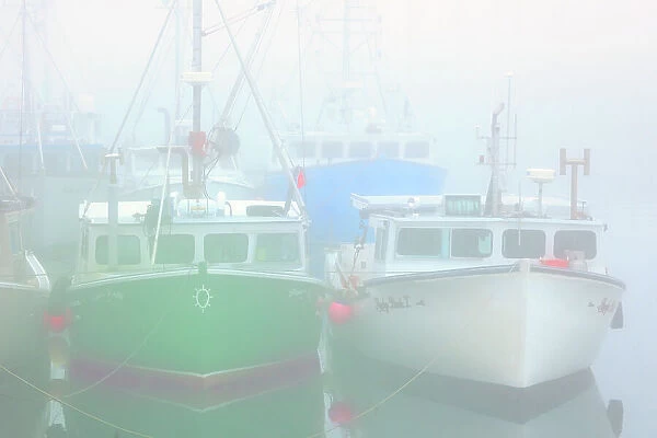 Fishing boats in fog at North Head Grand Manan Island, New Brunswick, Canada