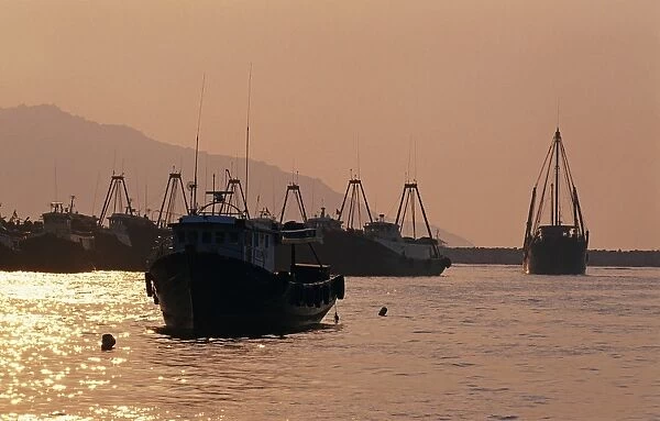 Fishing boats in the harbour of Cheung Chau at sunset