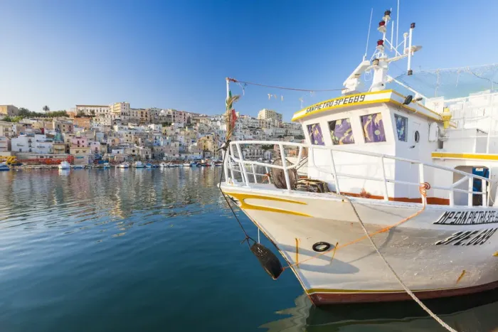 Framed Print : Fishing boats moored in the harbour surrounded by blue sea and the old town Sciacca Framed Print : Fishing boats moored in the harbour surrounded by blue sea and the old town Sciacca