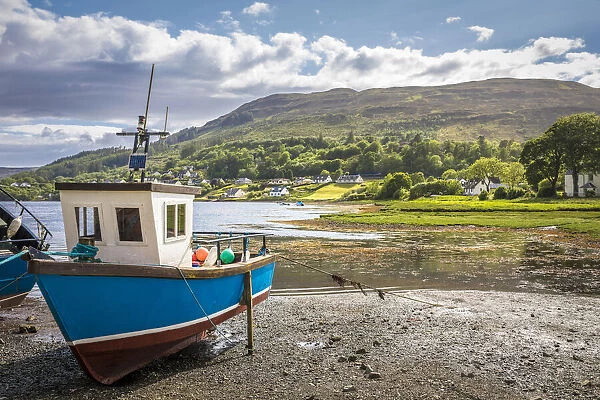 Fishing boats on the mouth of the River Leasgeary at Portree, Isle of Skye, Highlands