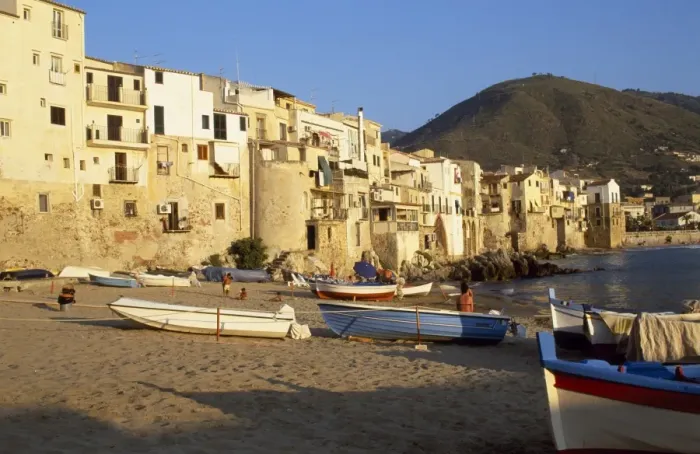 Framed Print : Fishing boats pulled up on the beach outside the old town at sunset Framed Print : Fishing boats pulled up on the beach outside the old town at sunset