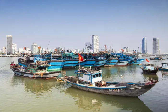 Framed Print : Fishing boats on Song River and city skyline, Da Nang, Vietnam
