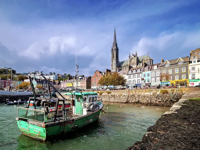 Framed Print : Fishing boats at the waterfront and St. Colman's Cathedral, Cobh, County Cork, Ireland