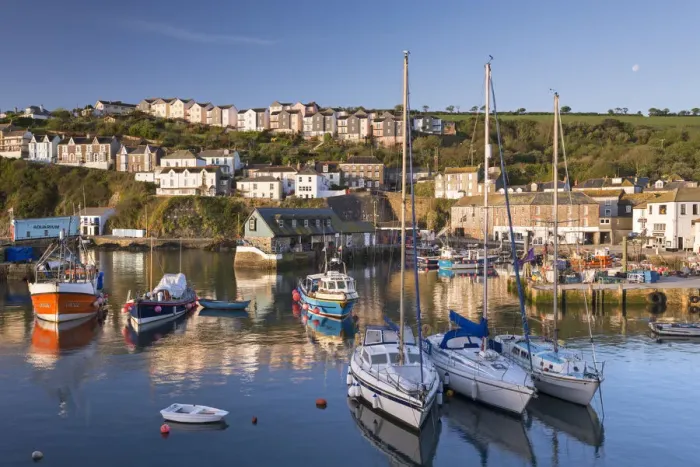 Framed Print : Fishing boats and yachts moored in Mevagissey harbour, Cornwall, England. Spring