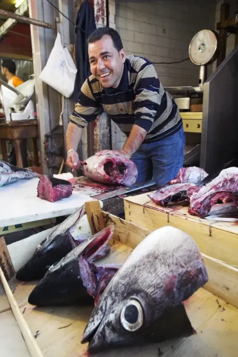 Framed Print : A fishmoger prepares fresh tuna