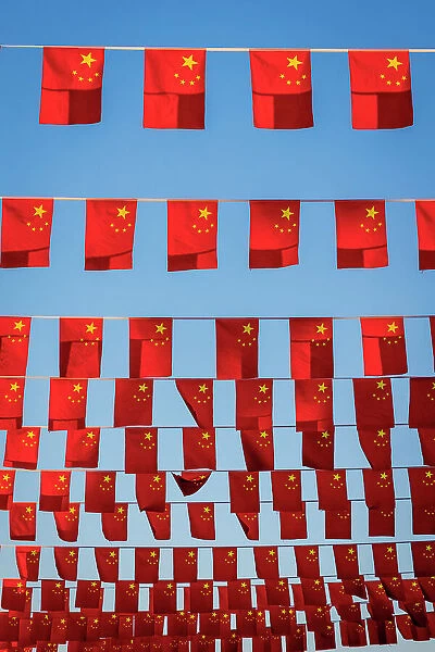 Flags displayed on city street, Beijing, China