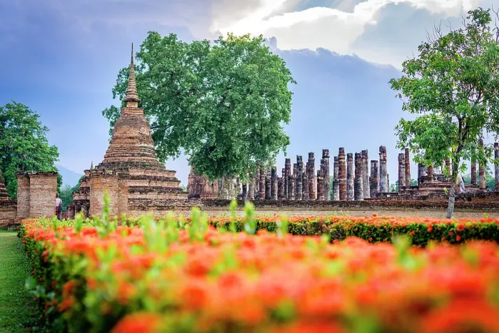 Framed Print : Flowers in bloom surrounding the Buddhist stupa in Wat Mahathat temple, Sukhothai Historical Park, Sukhothai, Thailand Framed Print : Flowers in bloom surrounding the Buddhist stupa in Wat Mahathat temple, Sukhothai Historical Park, Sukhothai, Thailand