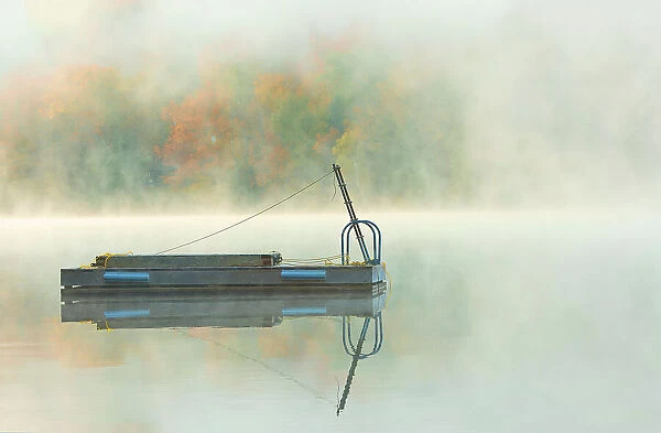 Fog on Horseshoe Lake in autumn with dock, Near Parry Sound, Ontario, Canada