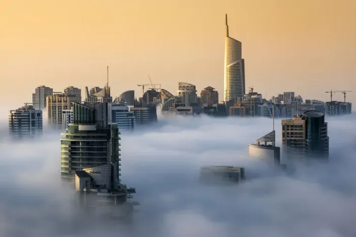 Framed Print : Foggy sunrise with Dubai Marinas skyscrapers towering over the low clouds Framed Print : Foggy sunrise with Dubai Marinas skyscrapers towering over the low clouds