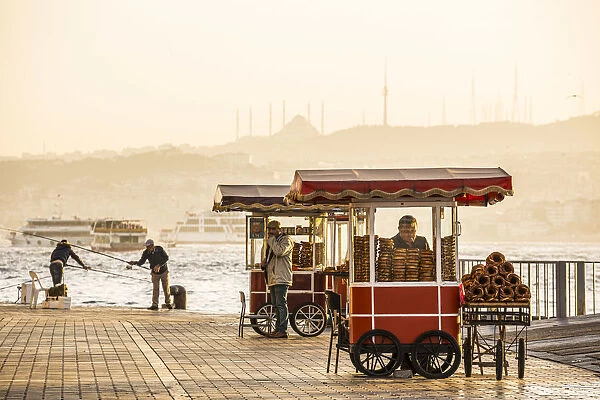 Food vendor selling simit, Golden Horn, Istanbul, Turkey