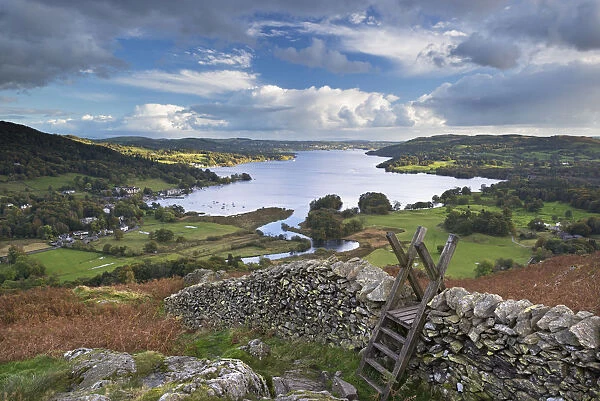 Footpath stile over dry stone wall, overlooking Lake Windermere, Lake District, Cumbria