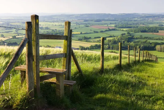 Framed Print : Footpath and style leading over fence through fields, Raddon Hill, Mid Devon, England Framed Print : Footpath and style leading over fence through fields, Raddon Hill, Mid Devon, England