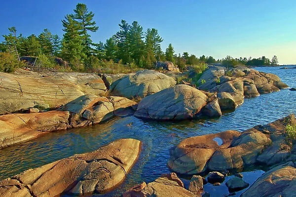 Forest and Precambrian Shield rock along Georgian Bay (Lake Huron) French River Provincial Park, Ontario, Canada