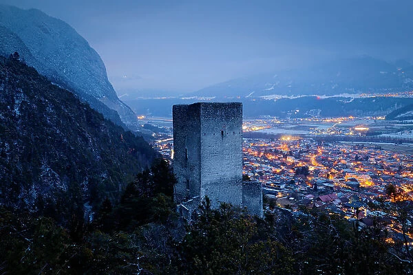 The Fragenstein castle ruins with Zirl town in the background on a winter evening, Zirl, Innsbruck Land, Tyrol, Austria