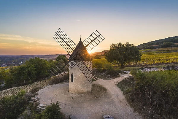 France, Bourgogne-Franche-Comte, Burgundy, Cote-d Or, Santenay. Windmill at sunset