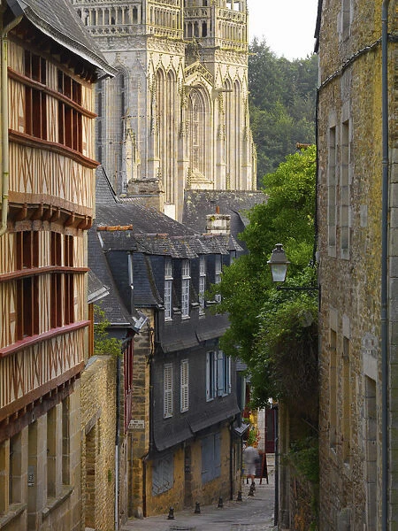 France, Brittany, Finistere, Quimper, view down cobbled street to Saint Corentin cathedral