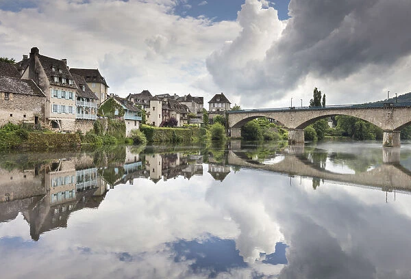 France, Correze, Argentat, The old town and bridge reflected in the Dordogne river