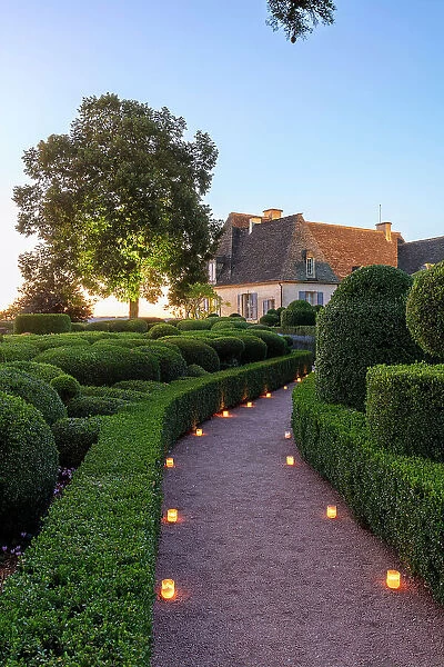 France, Dordogne, Perigord Noir, Dordogne valley, Vezac, Marqueyssac castle & boxwood gardens illuminated by candles at sunset