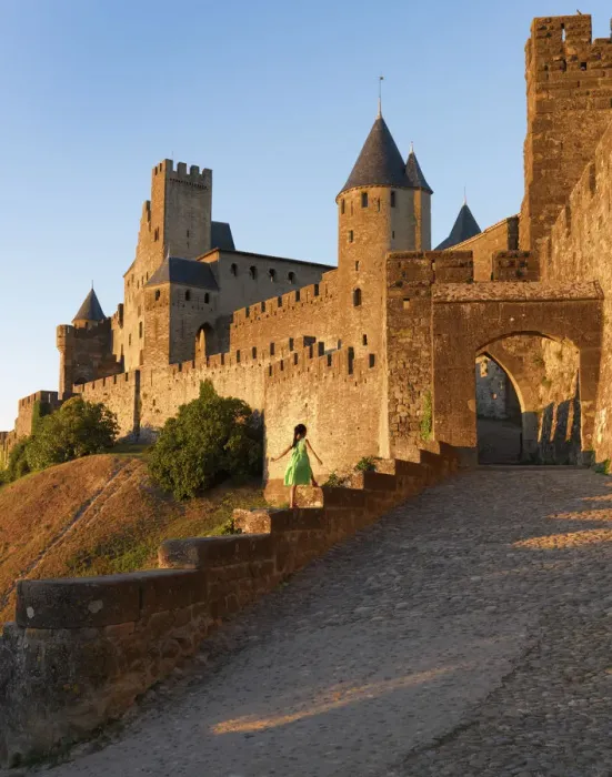 Framed Print : France, Languedoc, Carcassonne, girl walking on wall to Aude gate (MR) Framed Print : France, Languedoc, Carcassonne, girl walking on wall to Aude gate (MR)
