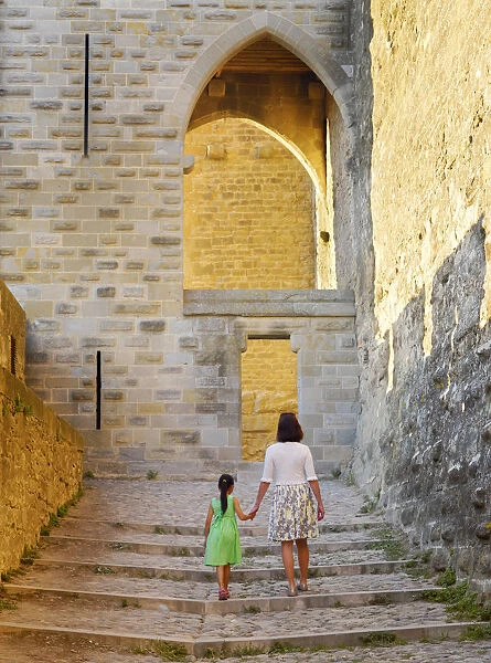 France, Languedoc, Carcassonne, Woman and girl walking (MR)