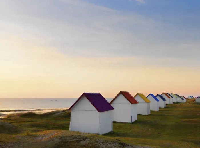 Framed Print : France, Normandy, Gouville Sur Mer, colourful beach huts at dusk Framed Print : France, Normandy, Gouville Sur Mer, colourful beach huts at dusk