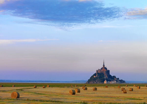 France, Normandy, Le Mont Saint Michel, hayfield at dusk