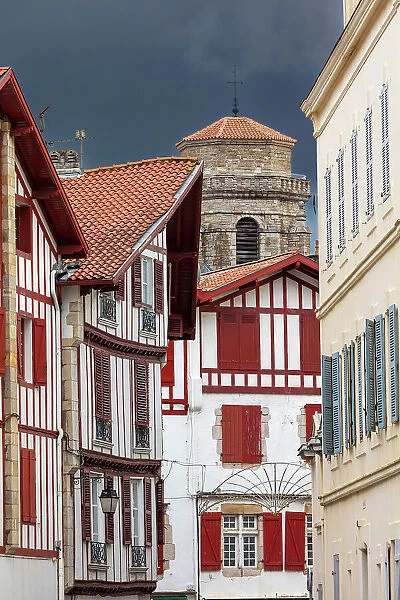 France, Nouvelle-Aquitaine, Pyrenees-Atlantiques, Pays Basque, Basque Country, Saint- Jean-de-Luz, a street with half-timbered buildings in the historical centre