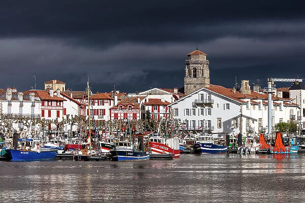 France, Nouvelle-Aquitaine, Pyrenees-Atlantiques, Pays Basque, Basque Country, Saint- Jean-de-Luz, fishing boats moored up in front of historical centre