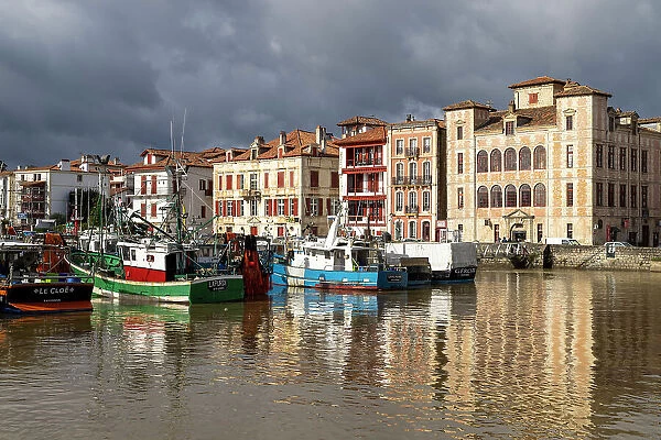 France, Nouvelle-Aquitaine, Pyrenees-Atlantiques, Pays Basque, Basque Country, Saint- Jean-de-Luz, fishing boats moored up in front of historical centre