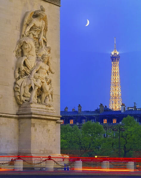 France, Paris, Arc de Triomphe and Eiffel Tower illuminated at night, close-up