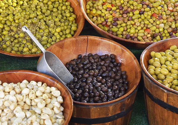 France, Provence, Alpes Cote d Azur, Castellane, olives in drums at market stall