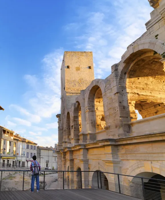 Framed Print : France, Provence, Arles, Man looking towards Roman Amphitheatre. MR