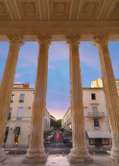 Framed Print : France, Provence, Nimes, Maison Caree, view through columns at dusk Framed Print : France, Provence, Nimes, Maison Caree, view through columns at dusk