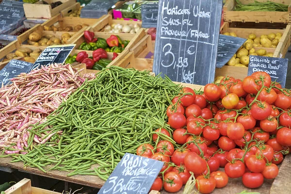 Fresh vegetables for sale in farmers market on Place aux Herbes in Uzes