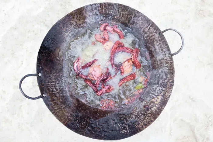 Framed Print : a freshly caught octopus is cooked on the beach, Zanzibar, Tanzania Framed Print : a freshly caught octopus is cooked on the beach, Zanzibar, Tanzania