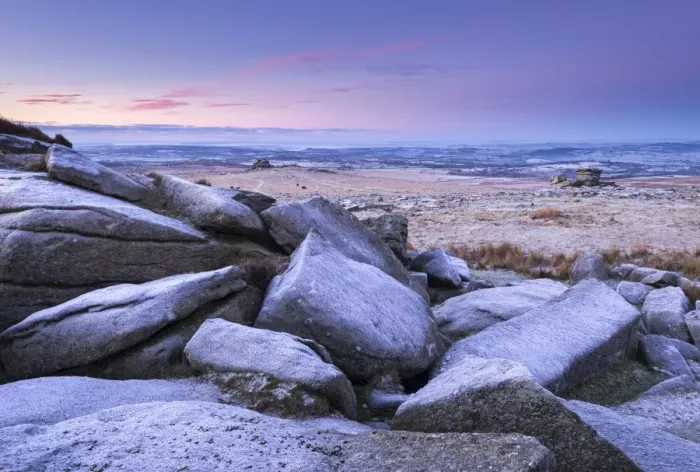 Framed Print : Frost covered granite boulders at Great Staple Tor in Dartmoor National Park, Devon, England