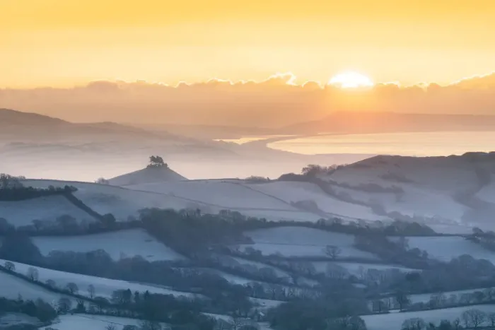 Framed Print : Frosty winter sunrise from Lamberts Castle looking across the Marshwood Vale towards
