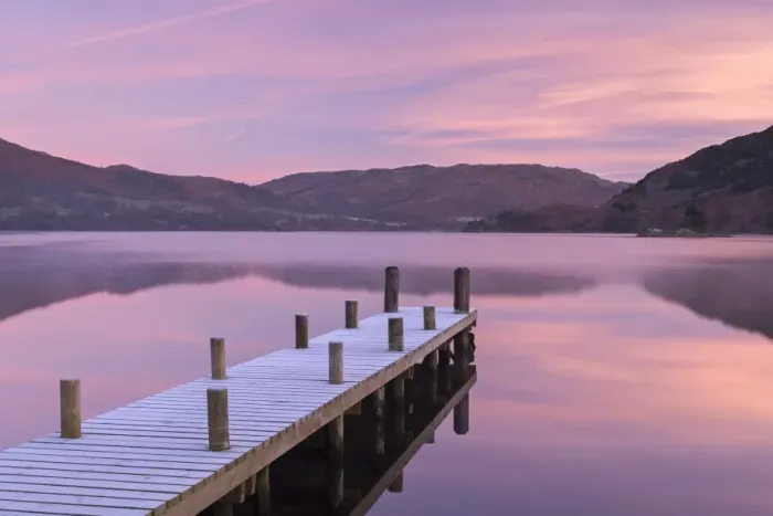 Framed Print : Frosty wooden jetty on Ullswater at dawn, Lake District, Cumbria, England. Winter