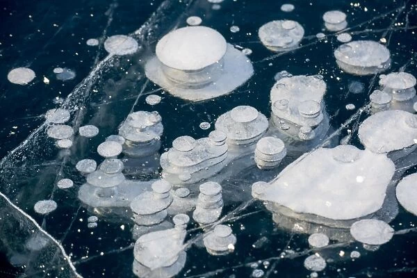 Frozen gas bubbles trapped in the ice. Silvaplana Lake, Silvaplana, Engadin, Graubunden