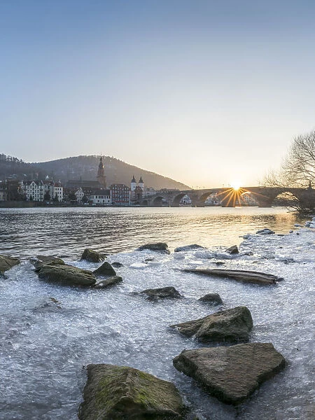 Frozen Neckar river and Old Bridge in Heidelberg, Baden-Wurttemberg, Germany