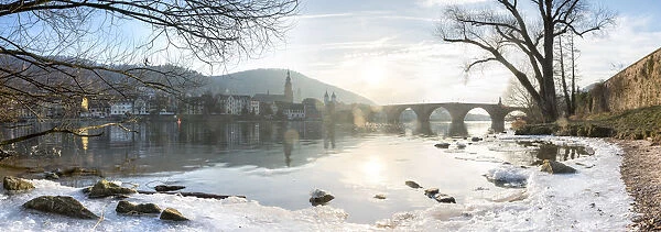 Frozen Neckar river and Old Bridge in Heidelberg, Baden-Wurttemberg, Germany