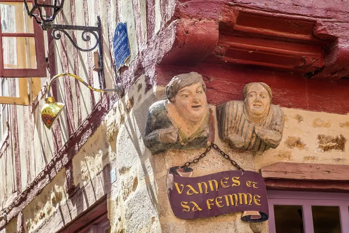 Framed Print : Funny figures on a half-timbered house in the old town of Vannes, Morbihan, Brittany, France Framed Print : Funny figures on a half-timbered house in the old town of Vannes, Morbihan, Brittany, France