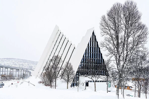 The futuristic building of Arctic Cathedral in the snowy landscape, Tromso, Norway