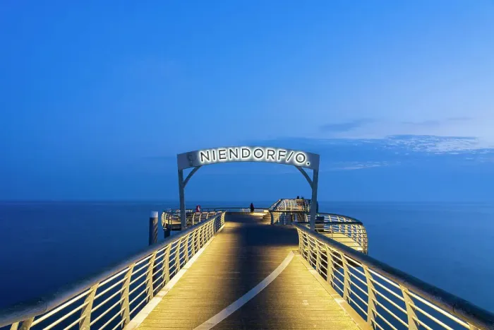Framed Print : Gate with Niendorf sign at Niendorf Pier at twilight, Niendorf, Timmendorfer Strand, Ostholstein, Schleswig-Holstein, Germany