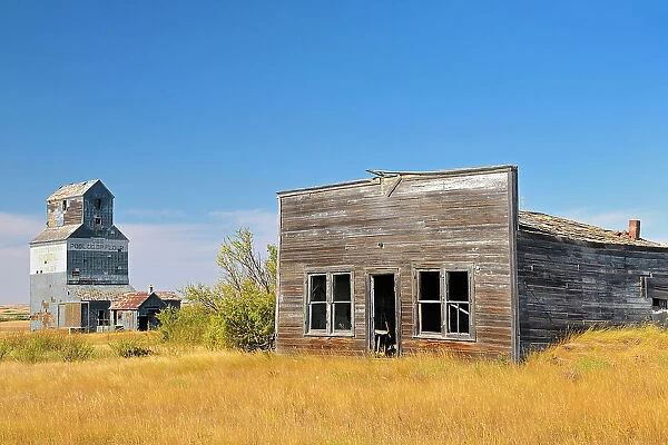 General store and grain elevator in ghost town Fusiller Saskatchewan, Canada