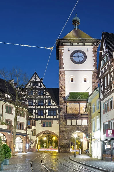 Germany, Baden-WAorttemberg, Freiburg im Breisgau. Schwabentor (Swabian Gate) at night