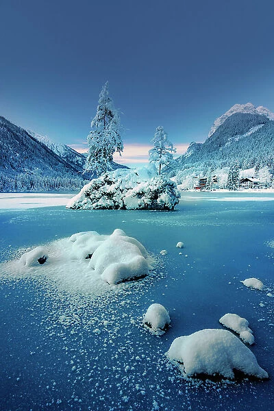 Germany, Bavaria, Lake Hintersee frozen in winter against Hochkalter, Berchtesgaden Alps