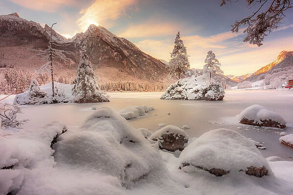 Germany, Bavaria, Lake Hintersee frozen in winter against Hochkalter, Berchtesgaden Alps